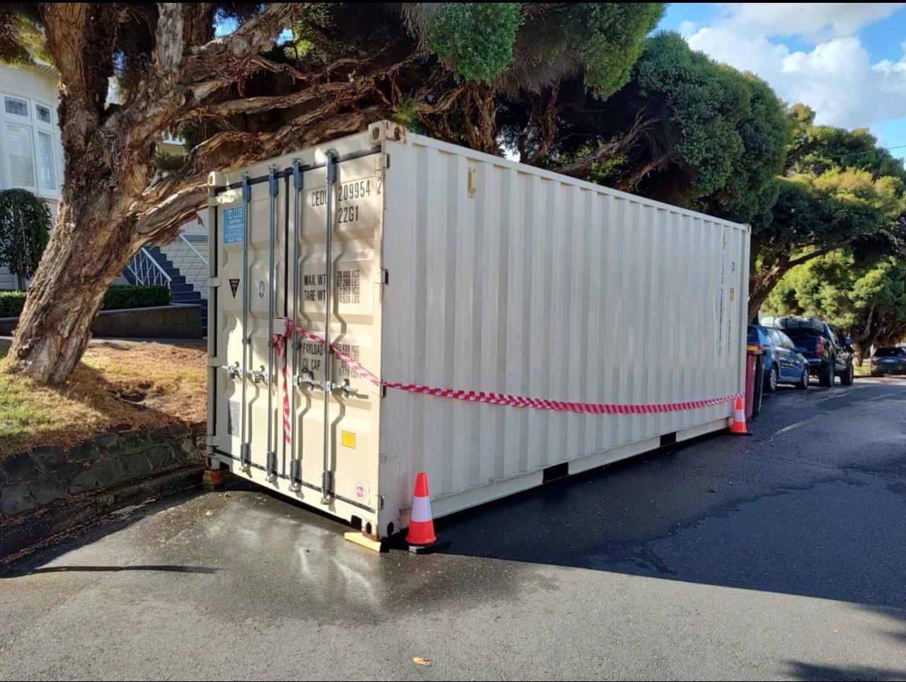 Container Delivered to Ground by Tilt Bed Truck